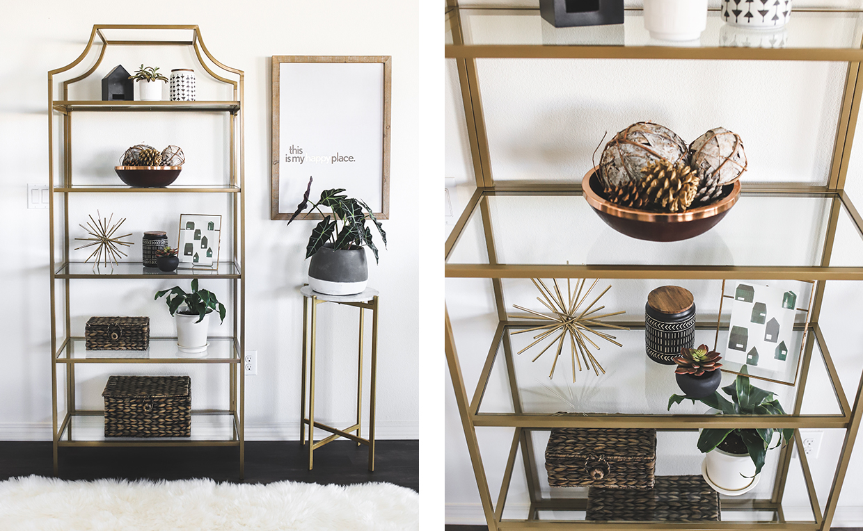 Gold metal and glass tower bookcase in dining room