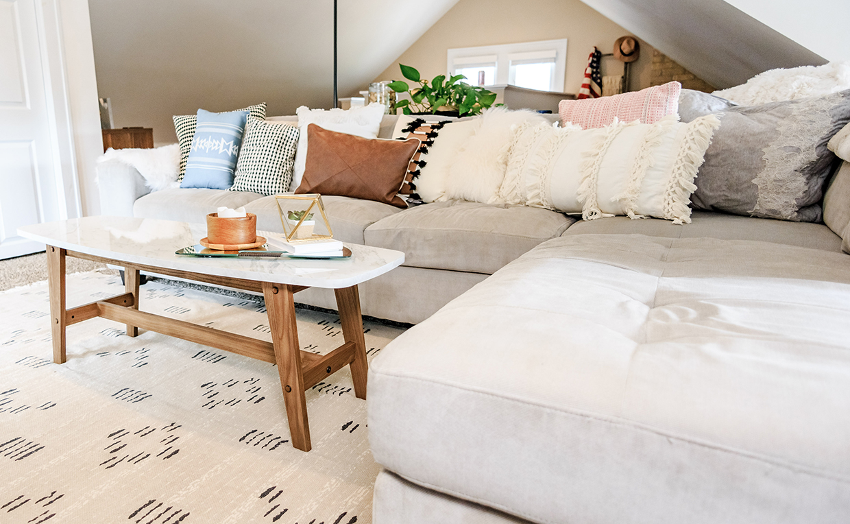 Blog6_1240x764_05.jpg Attic with couch, table and rug