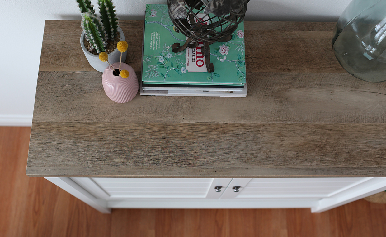 Cottage-style storage cabinet with woodgrain top