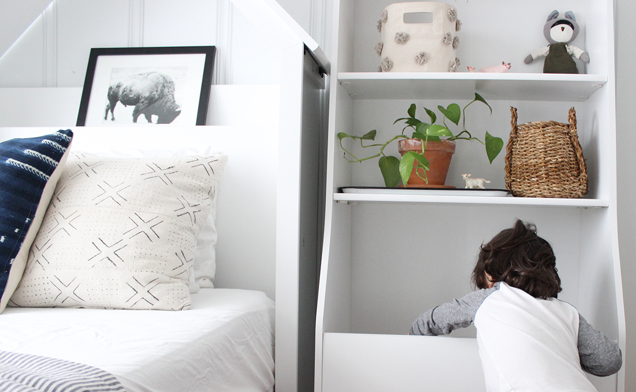 White bin bookcase storage, white twin headboard, kids’ bedroom